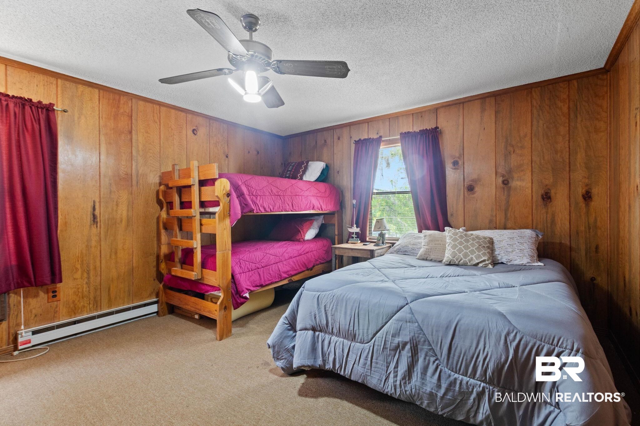 8153 Bryant's Lndg Road Stockton, AL 36579 - Photo 46 of 87 Interior room featuring wood paneling walls, a textured ceiling, and carpet flooring