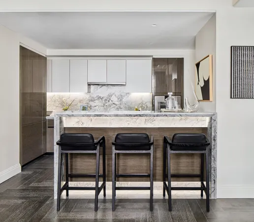 a kitchen with a table and chairs in it