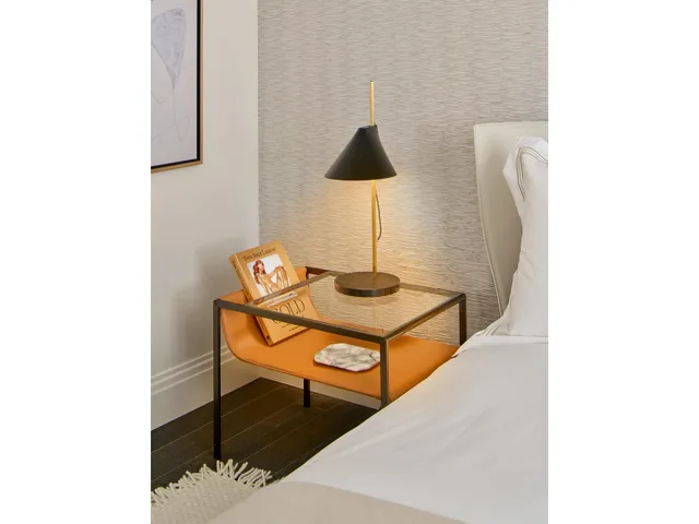 a view of a hallway with wooden floor and a living room