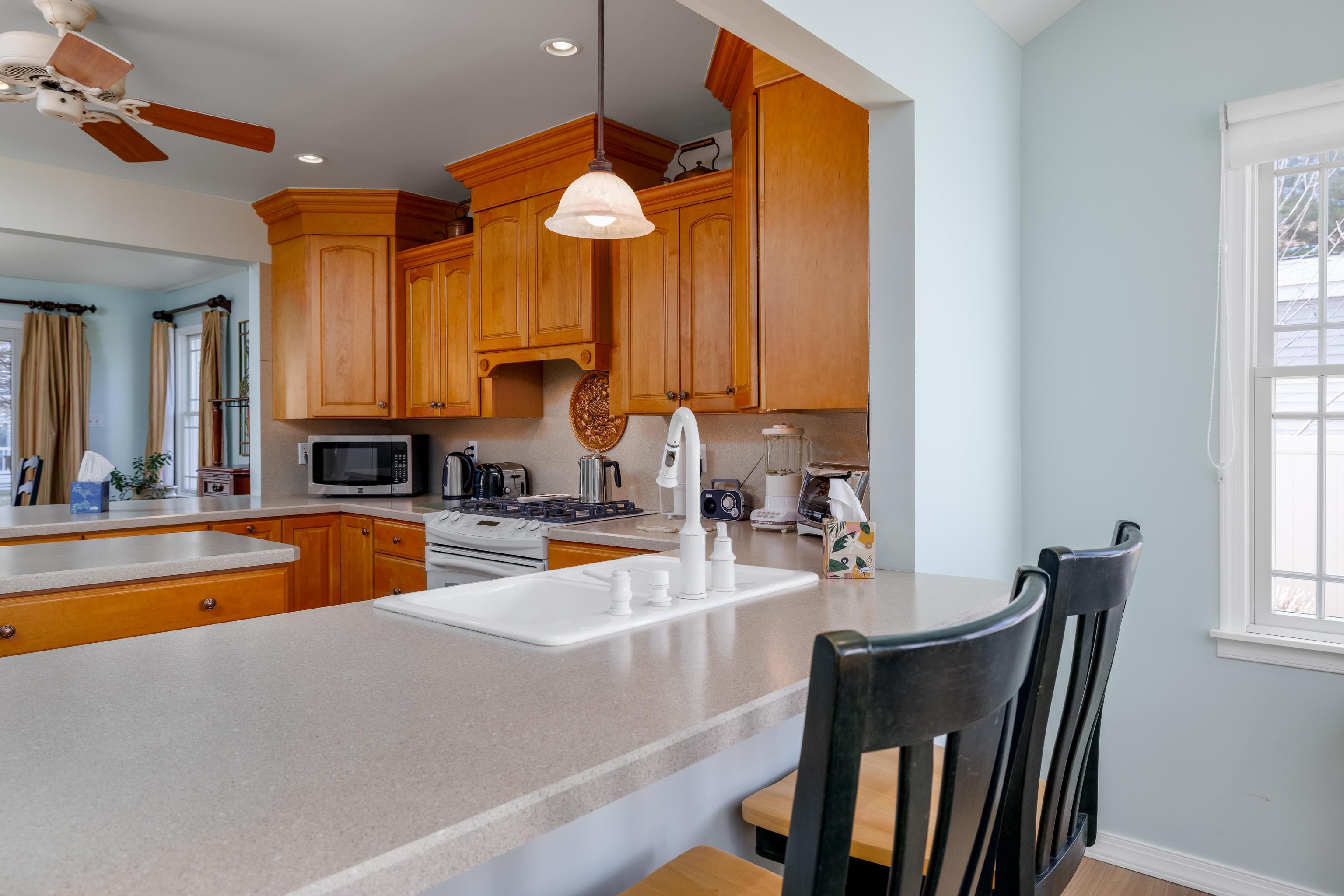 5 Adelphia Road Cape May, NJ 08204 - Photo 13 of 48 a large kitchen with a table and chairs