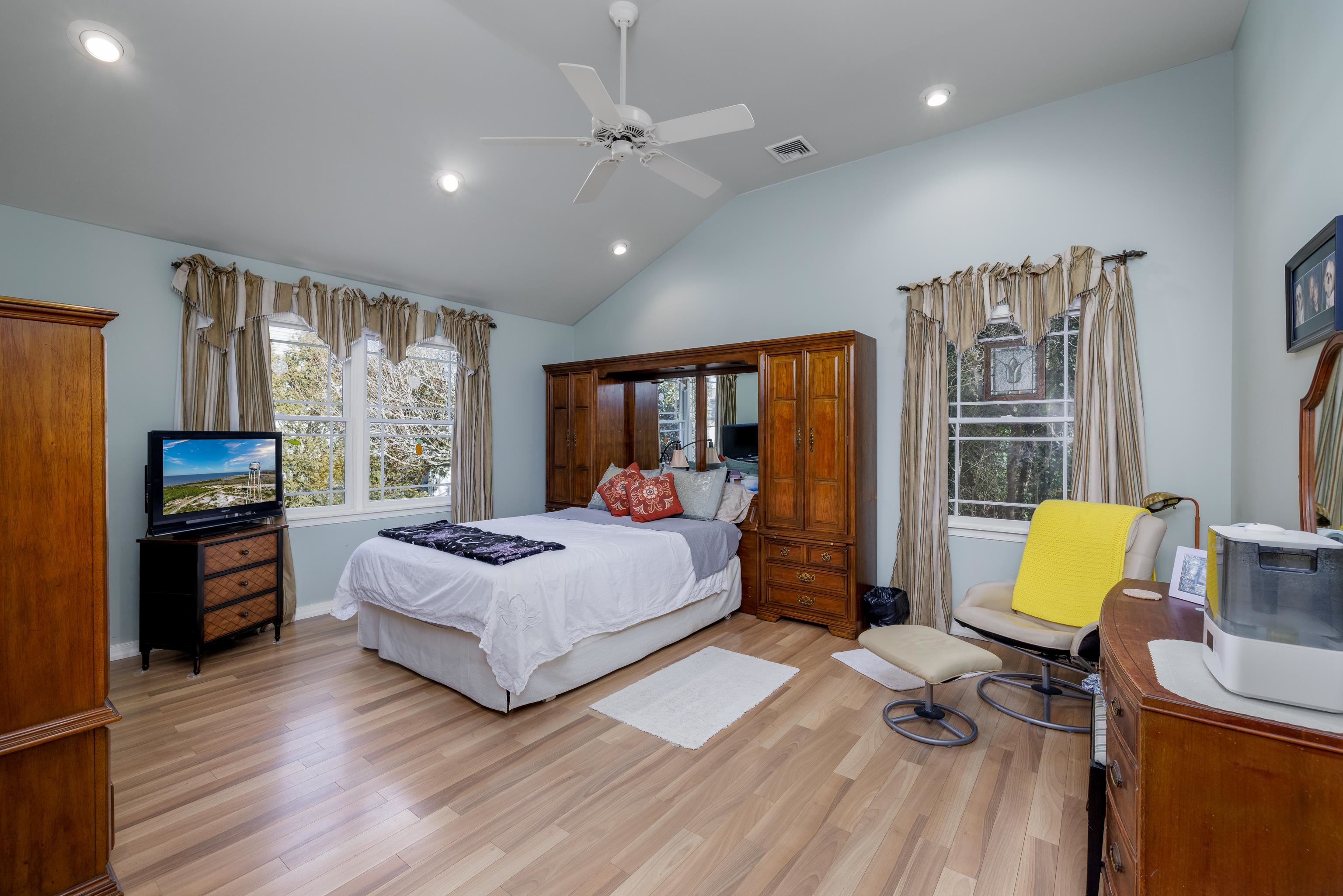 5 Adelphia Road Cape May, NJ 08204 - Photo 20 of 48 a spacious bedroom with a bed and wooden floor