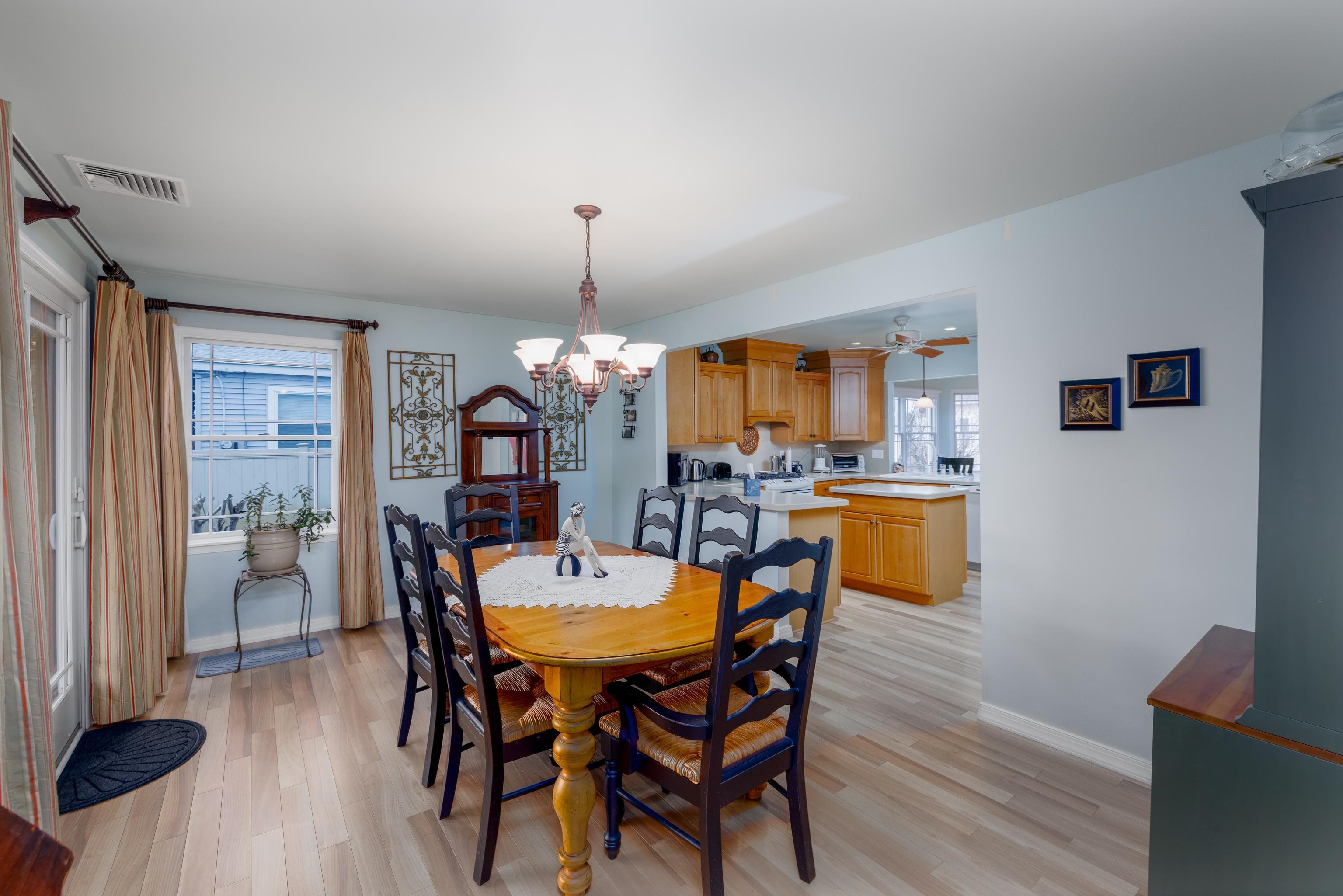 5 Adelphia Road Cape May, NJ 08204 - Photo 8 of 48 a view of a dining room with furniture and wooden floor