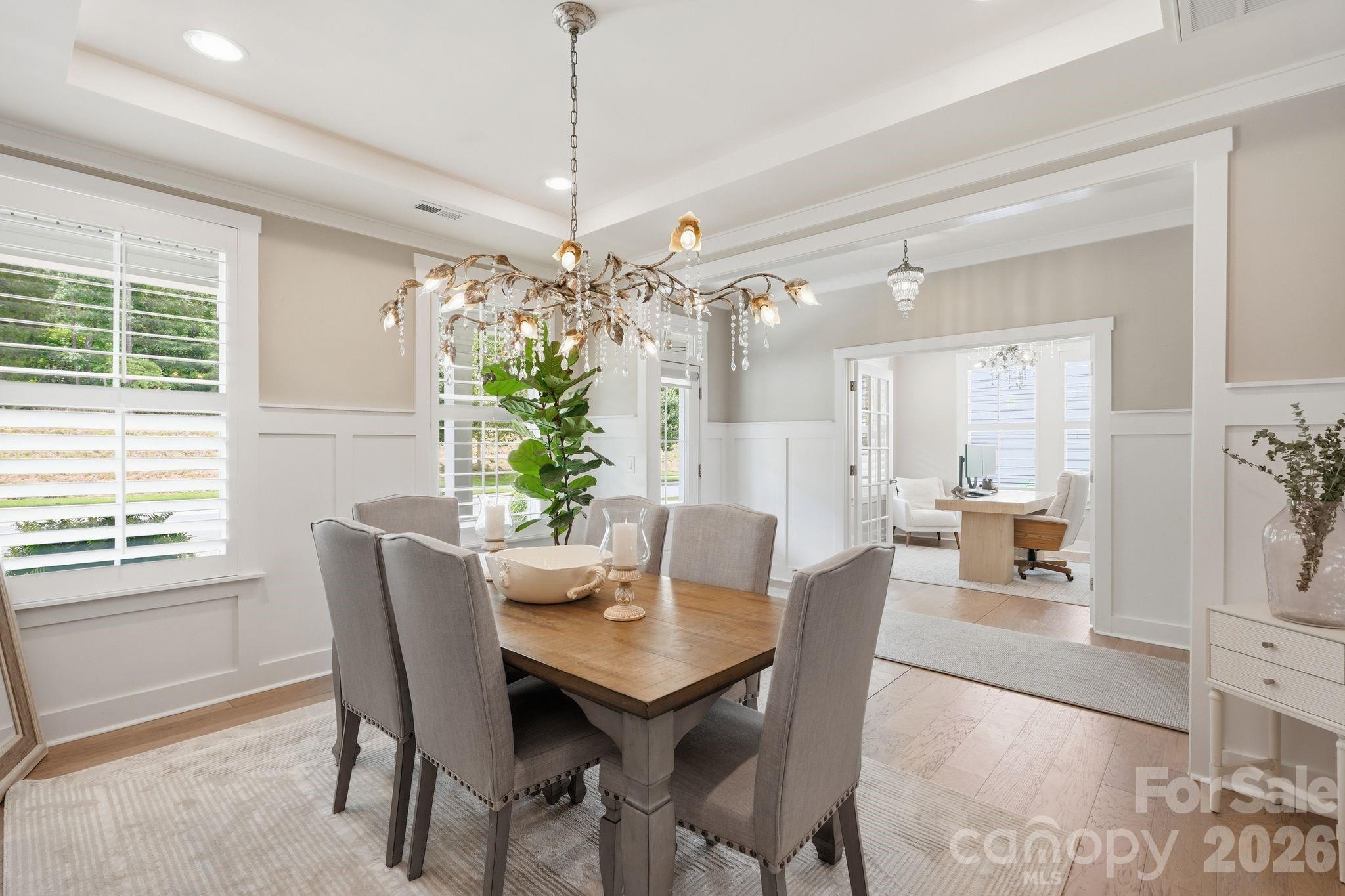 1086 Weir Court Fort Mill, SC 29708 - Photo 7 of 40 a view of a dining room with furniture window and chandelier