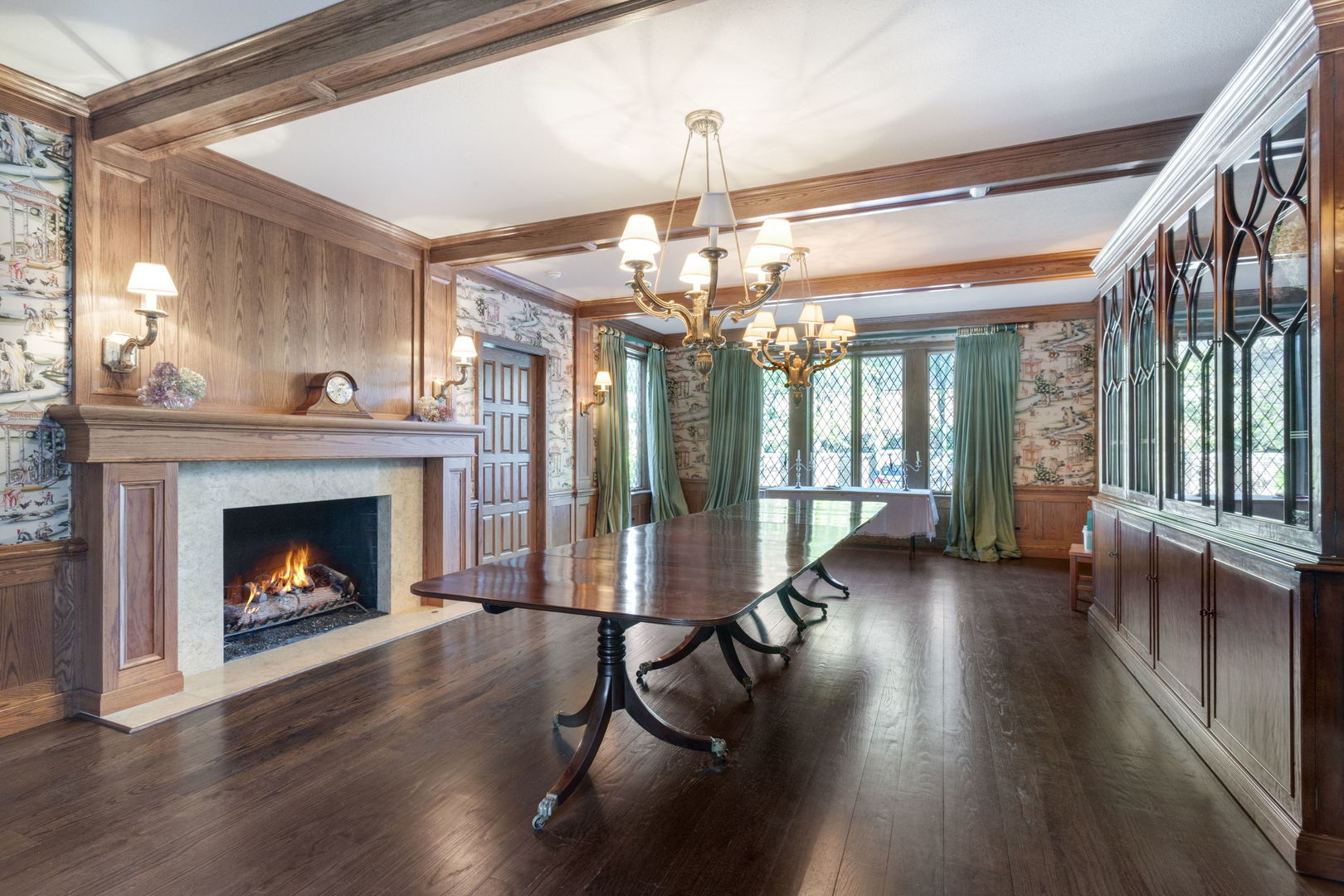 1490 Lake Road Lake Forest, IL 60045 - Photo 15 of 44 a living room with wooden floor fireplace and chandelier