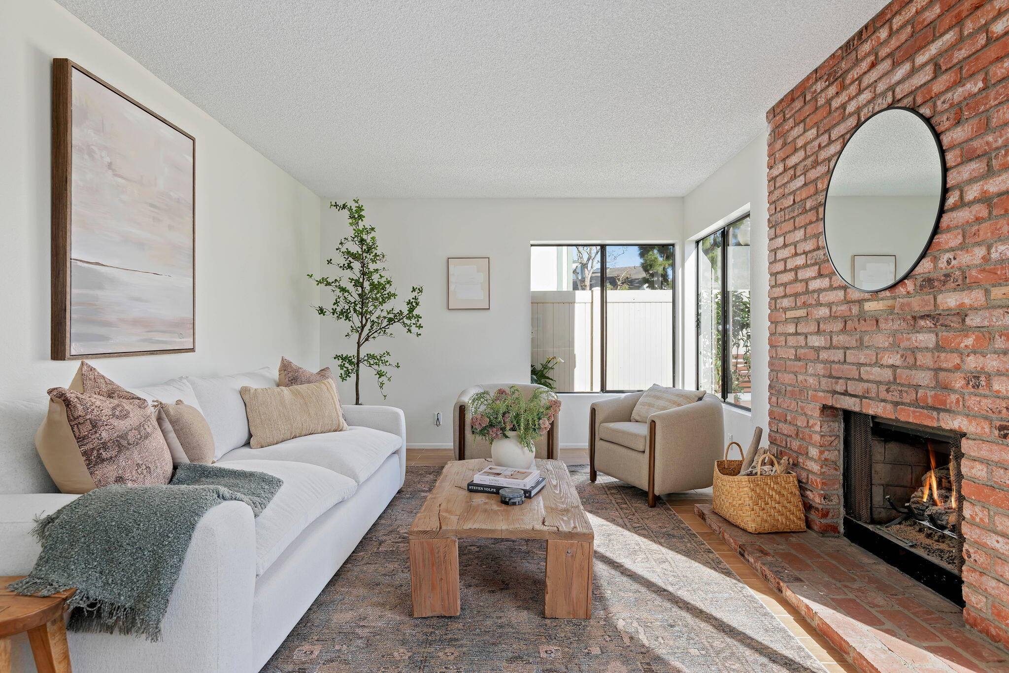 3426 Olds Road Oxnard, CA 93033 - Photo 11 of 30 a living room with furniture a fireplace and a large window