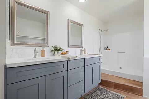 a bathroom with a sink and a mirror