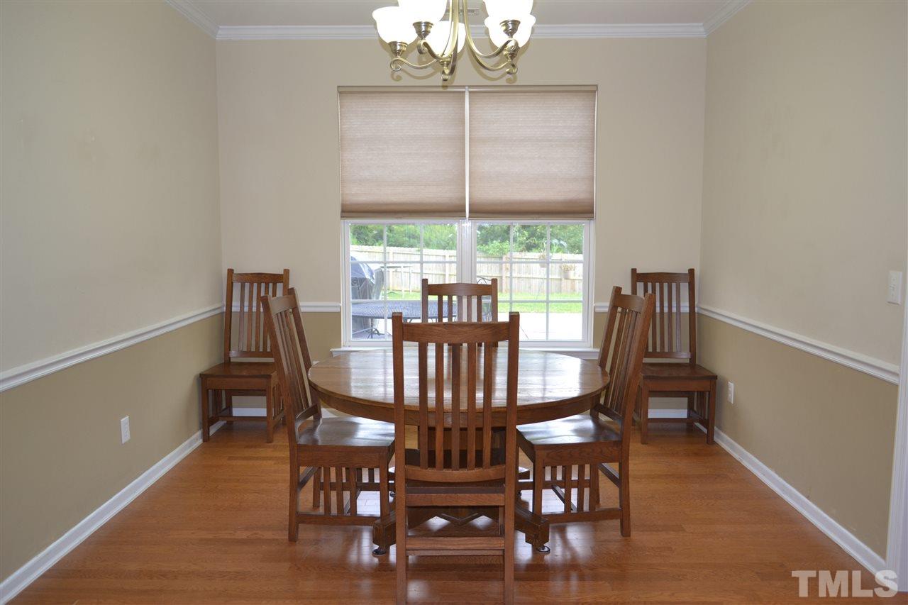 1421 Reynolds Mill Road Wake Forest, NC 27587 - Photo 4 of 18 Bright dining room area with plenty of space for additional chairs, guests, buffet cabinet and more!