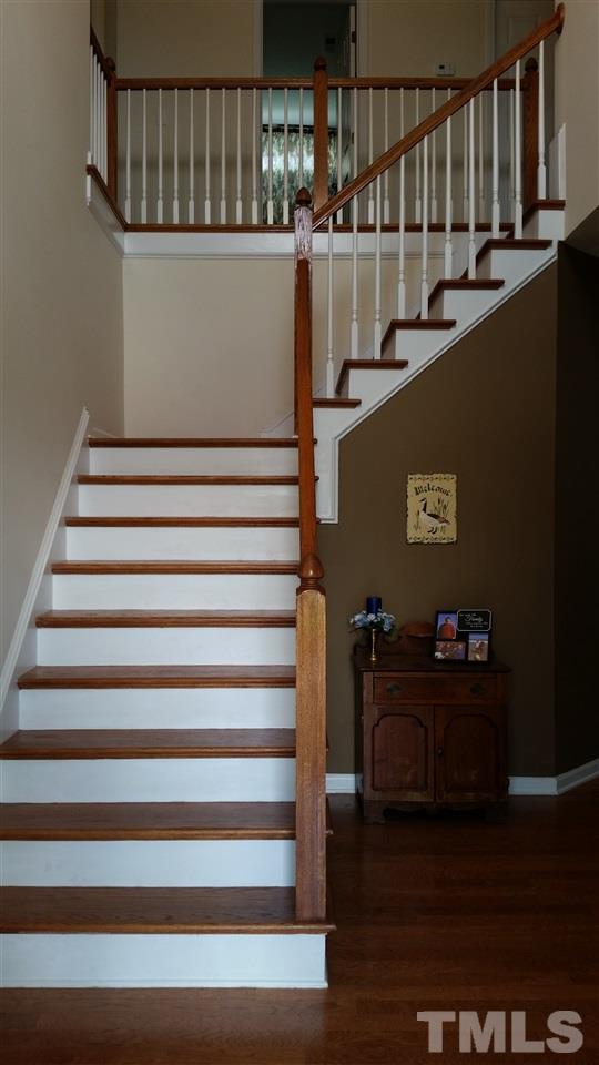 1421 Reynolds Mill Road Wake Forest, NC 27587 - Photo 5 of 18 Foyer opens up to a beautiful stairwell. Off to the left is the entrance into the living room area - owner currently using this area as game room/exercise area.