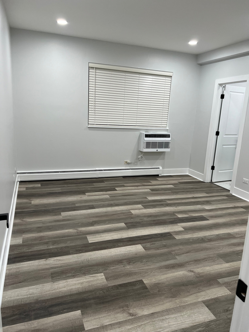 290 North Westgate Road, Unit 401 Mount Prospect, IL 60056 - Photo 13 of 15 a view of room with stairs and a wooden floor