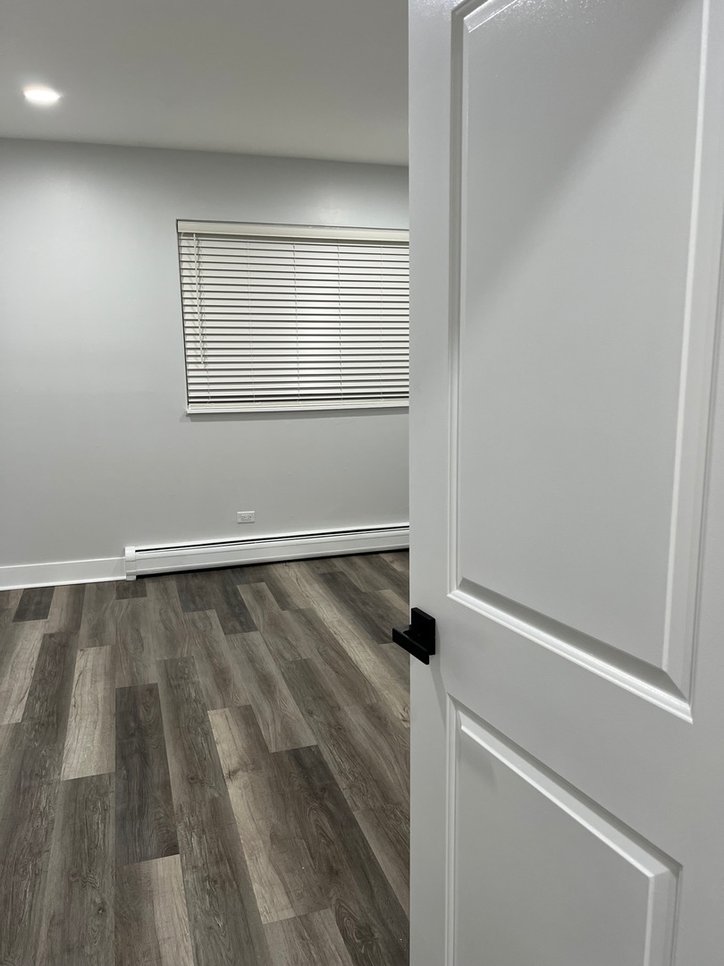 290 North Westgate Road, Unit 401 Mount Prospect, IL 60056 - Photo 14 of 15 wooden floor in an empty room