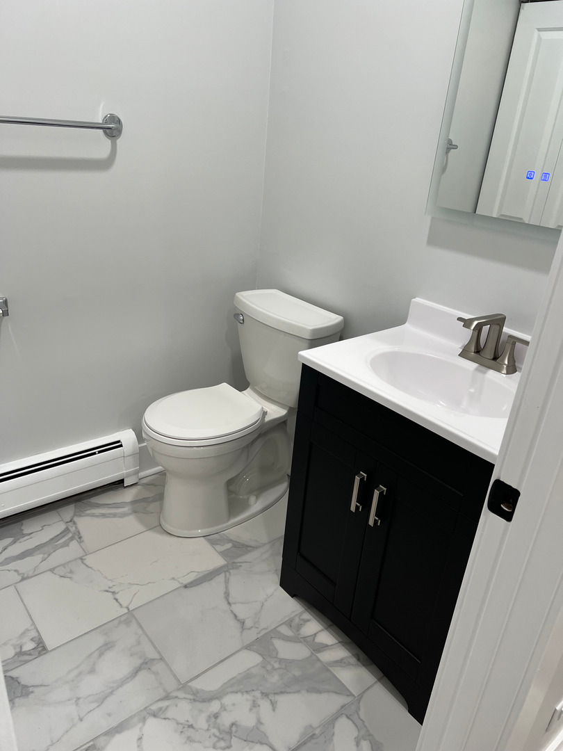 290 North Westgate Road, Unit 401 Mount Prospect, IL 60056 - Photo 9 of 15 a bathroom with a sink and a toilet
