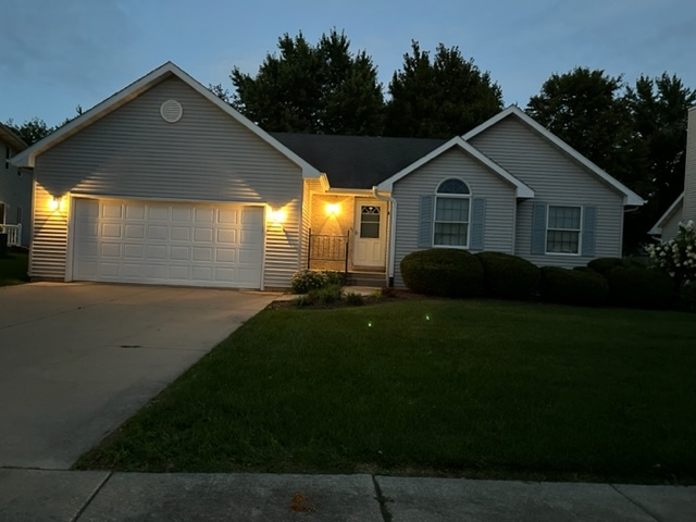 1121 McCall Court Rochelle, IL 61068 - Photo 1 of 41 a front view of a house with a yard and garage