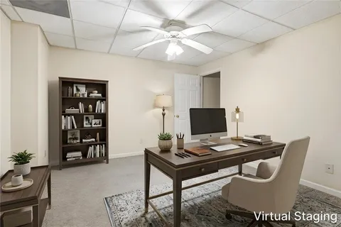 a view of a workspace with furniture