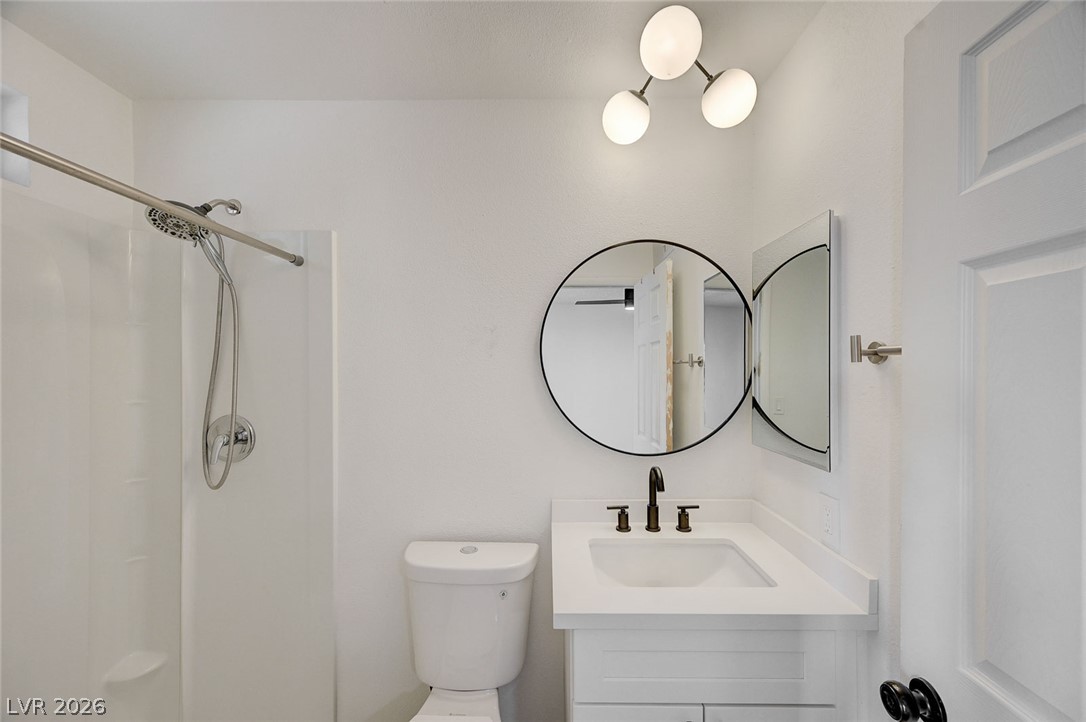 4840 Summerhill Road Las Vegas, NV 89121 - Photo 29 of 56 A well-appointed bathroom features a contemporary vanity, modern fixtures, and an integrated shower.