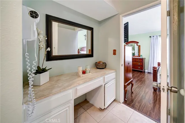 a bathroom with a sink a mirror and a vanity