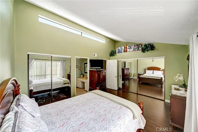 a bedroom with a bed and dresser