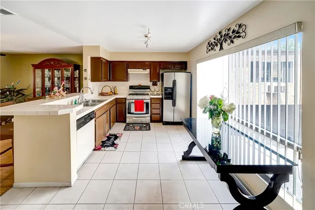 a very nice looking room with many windows and furniture