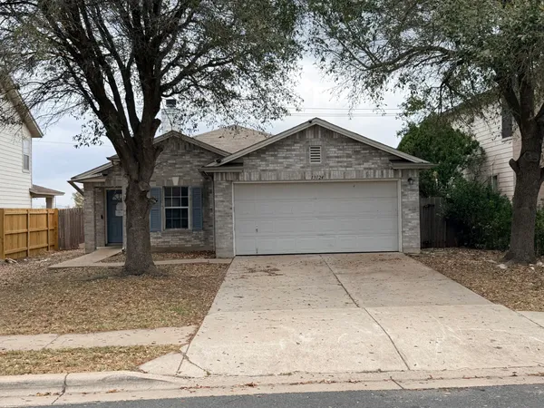 front view of a house with a trees