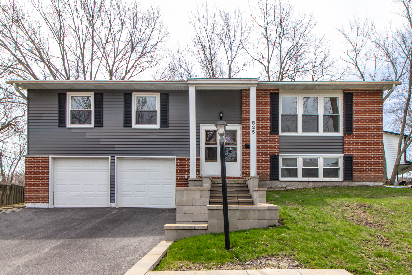825 Freeman Road Hoffman Estates, IL 60192 - Photo 1 of 30 front view of a house with a yard