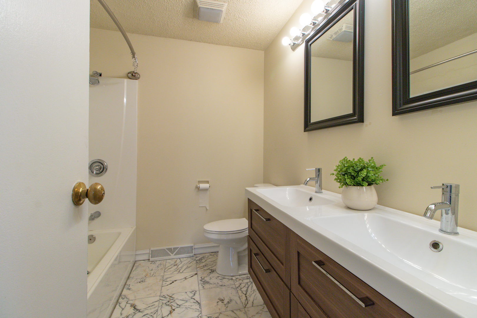825 Freeman Road Hoffman Estates, IL 60192 - Photo 17 of 30 a bathroom with a sink toilet and shower