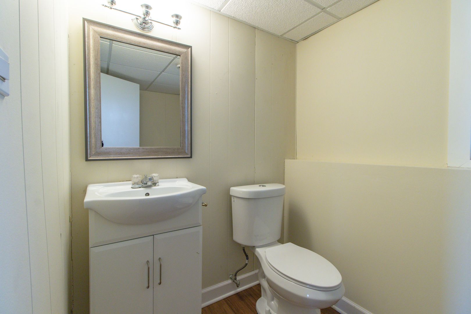825 Freeman Road Hoffman Estates, IL 60192 - Photo 21 of 30 a white toilet sitting next to a bathroom sink