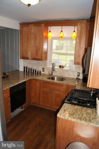 719 Anneslie Road Baltimore, MD 21212 - Photo 14 of 30 View of kitchen from dual staircase