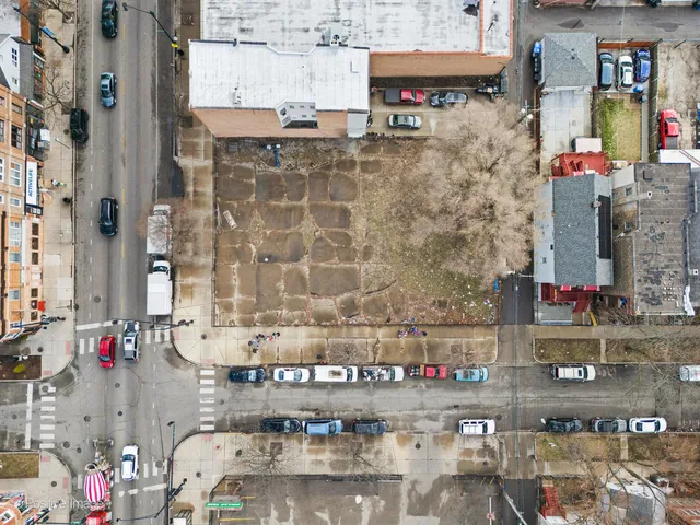 a aerial view of a building with a street