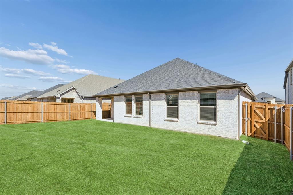 769 Sierra Ridge Lavon, TX 75166 - Photo 33 of 37 Covered Patio in the Harrison home plan by Trophy Signature Homes – REPRESENTATIVE PHOTO