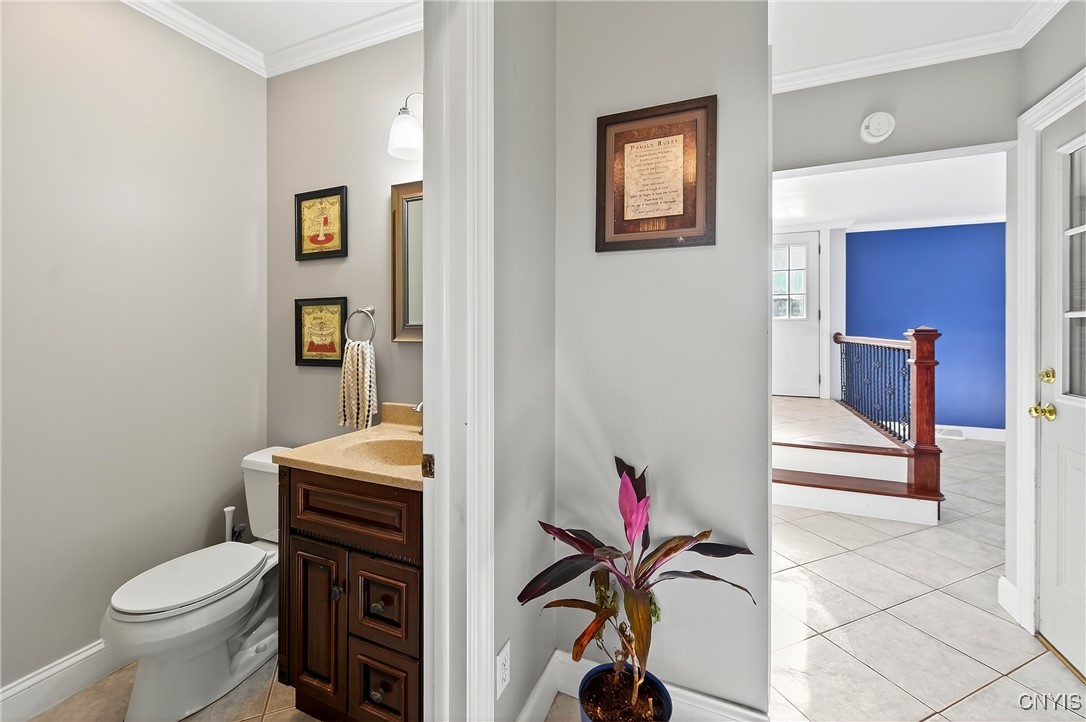 7949 Boxford Road Clay, NY 13041 - Photo 18 of 50 1st floor half bath off foyer nad entrance to 2 ca