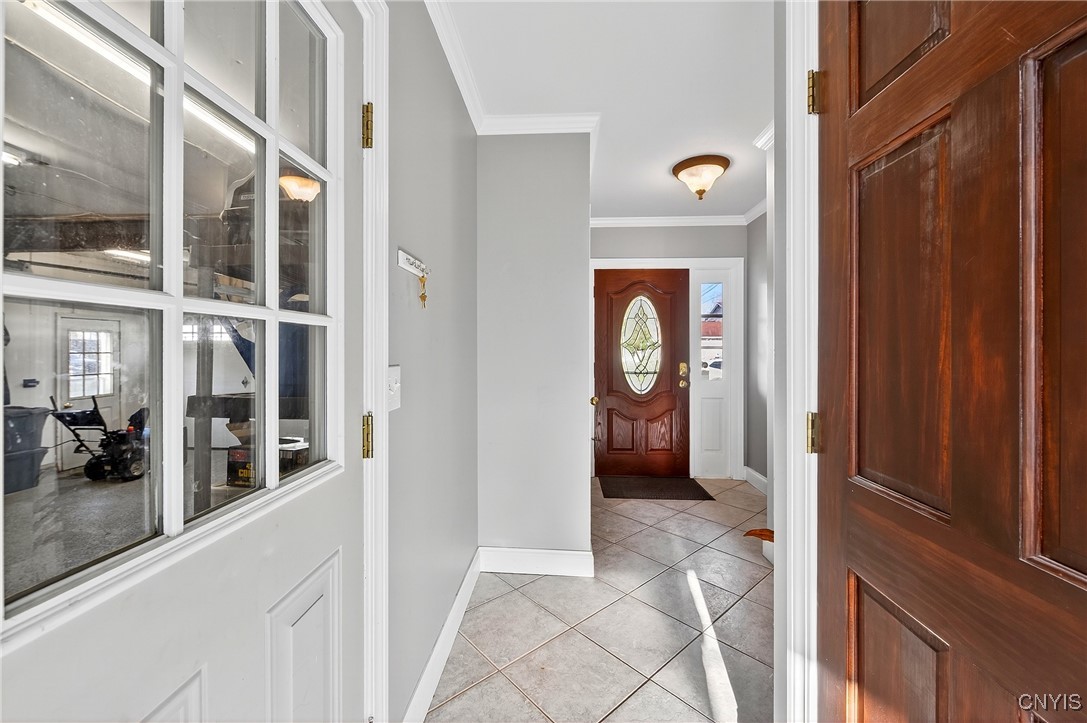7949 Boxford Road Clay, NY 13041 - Photo 4 of 50 Entrance to garage and livingroom from foyer