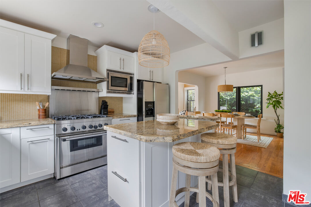 3004 Yale Avenue Marina del Rey, CA 90292 - Photo 13 of 42 a kitchen with a stove and white cabinets