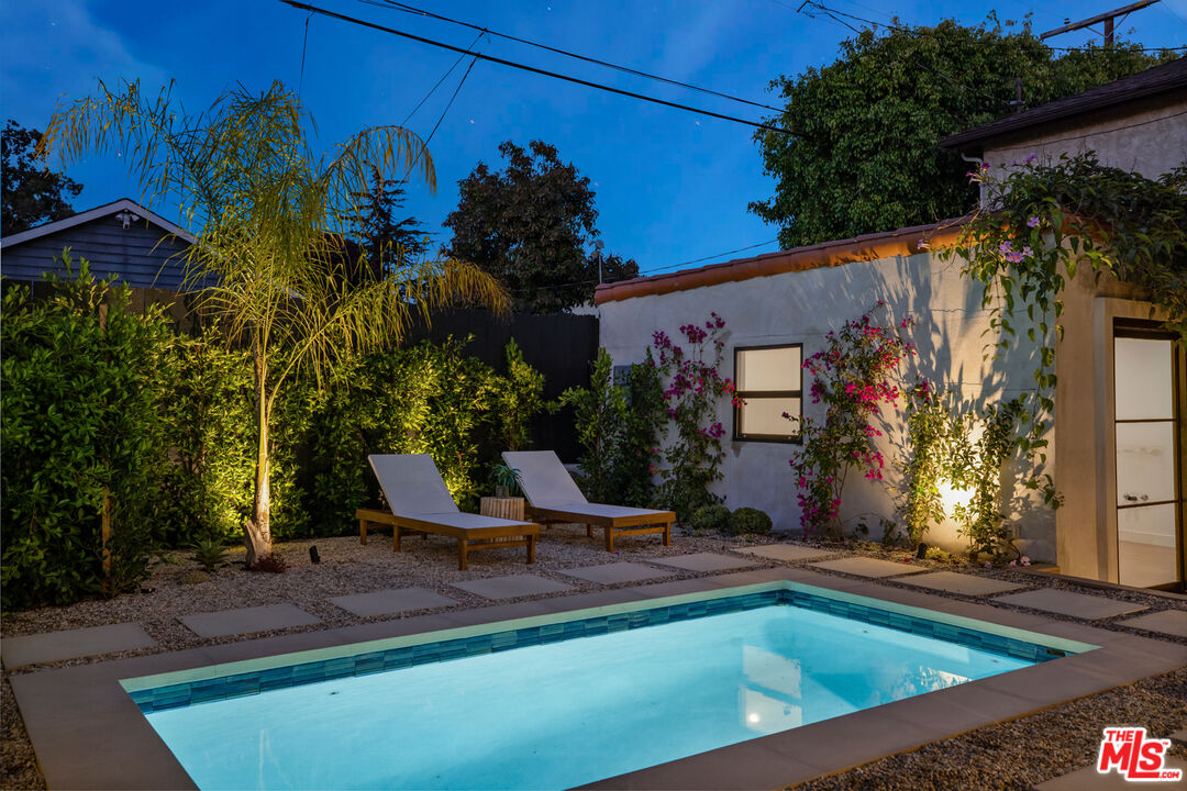 3004 Yale Avenue Marina del Rey, CA 90292 - Photo 2 of 42 a view of a swimming pool with a bench and trees
