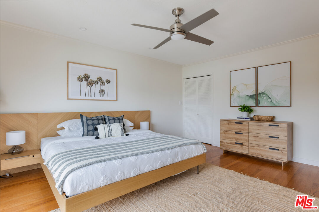 3004 Yale Avenue Marina del Rey, CA 90292 - Photo 21 of 42 a bedroom with a bed a chandelier and a dresser