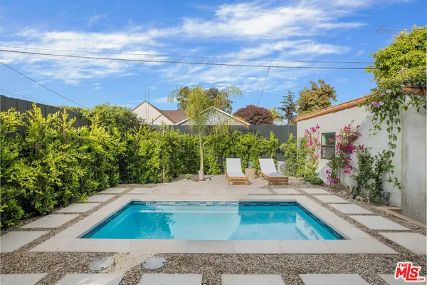 a view of a swimming pool with a yard