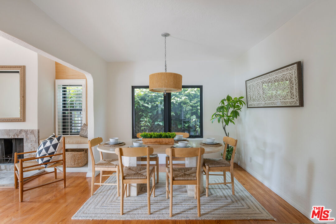 3004 Yale Avenue Marina del Rey, CA 90292 - Photo 9 of 42 a dining room with furniture a window and a chandelier