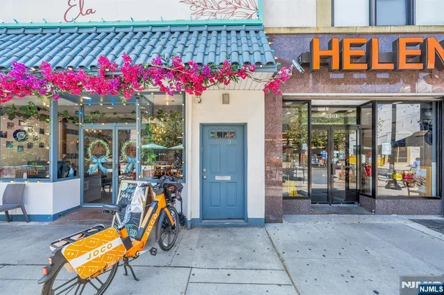 a view of a cafe with sitting area