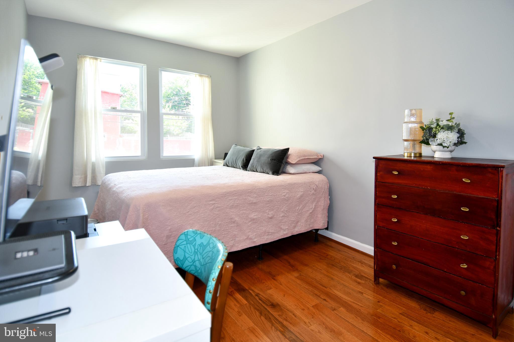 1643 Montello Avenue Northeast, Unit 4 Washington, DC 20002 - Photo 12 of 30 a bedroom with a bed and window