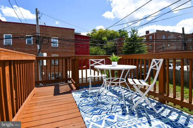 a view of a chairs on the roof deck