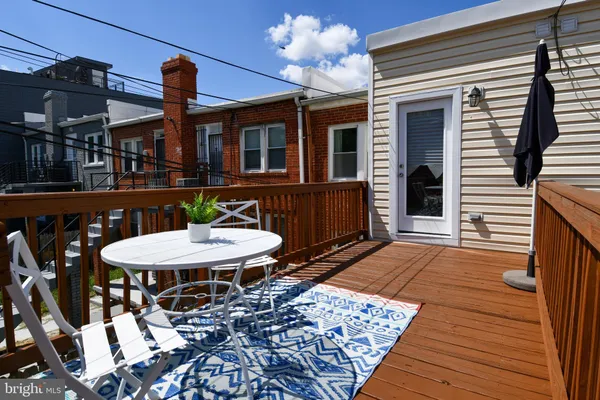 a dinning table and chairs in a patio