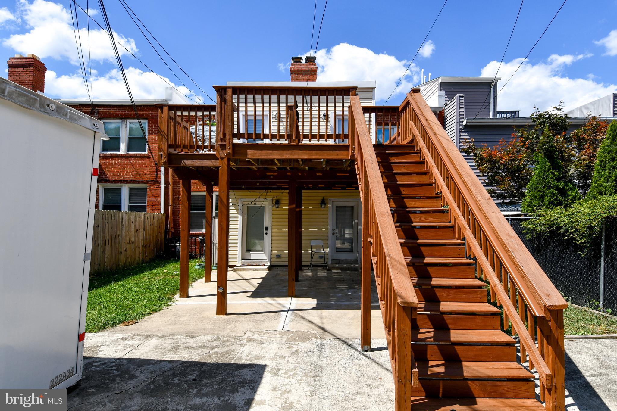 1643 Montello Avenue Northeast, Unit 4 Washington, DC 20002 - Photo 23 of 30 a front view of a house with a yard
