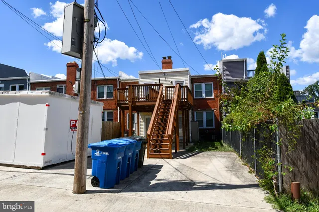 a view of a house with large windows