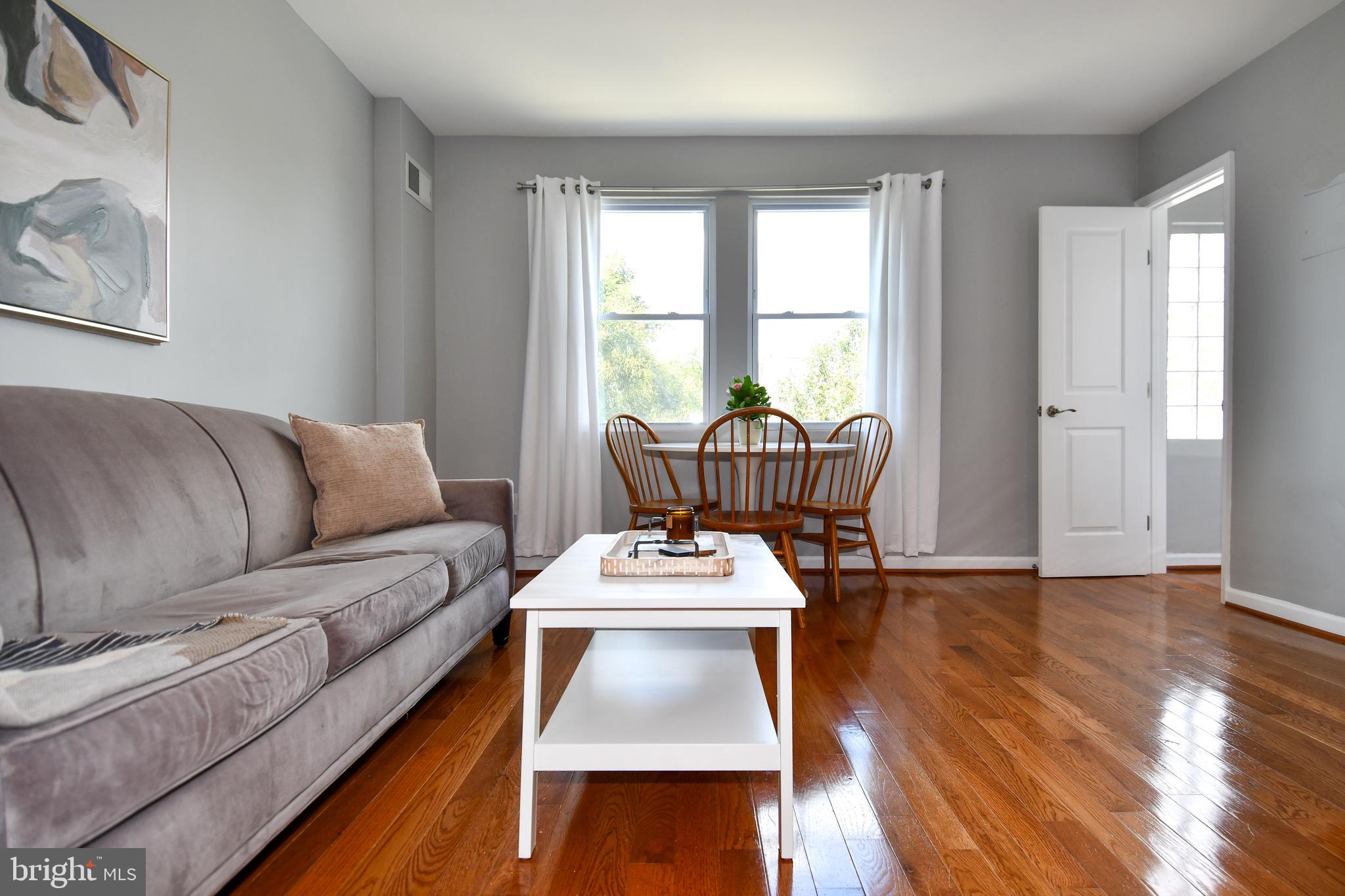 1643 Montello Avenue Northeast, Unit 4 Washington, DC 20002 - Photo 7 of 30 a living room with furniture and a window