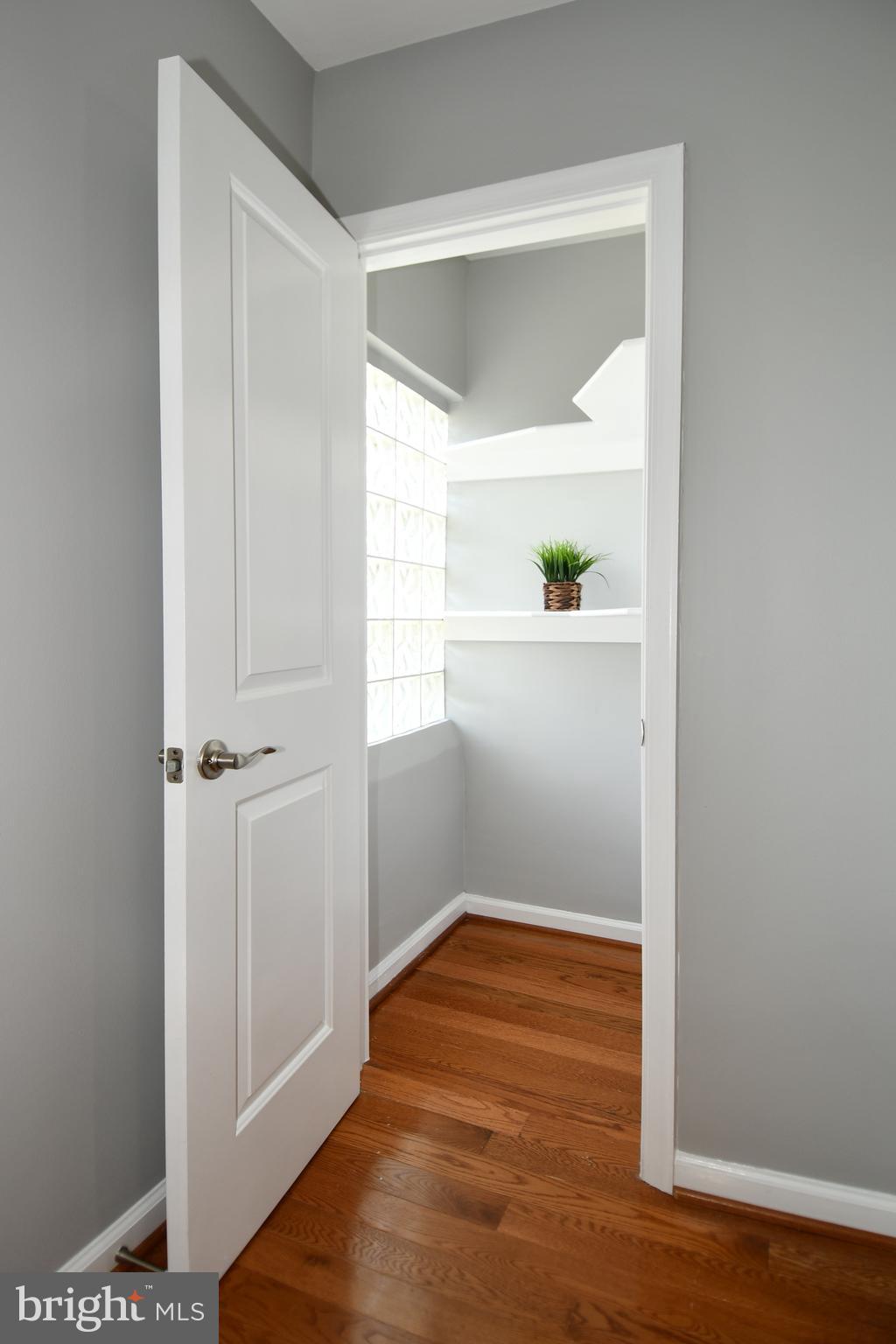 1643 Montello Avenue Northeast, Unit 4 Washington, DC 20002 - Photo 9 of 30 a view of a small space with wooden floor and a window