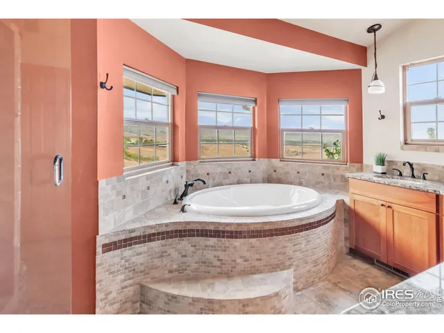 a view of a porch with furniture and garden