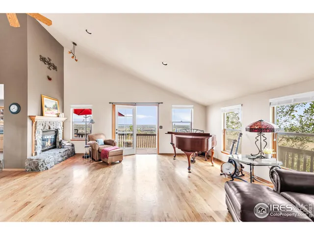 a view interior of a house with wooden floor windows and a fireplace