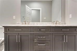 6814 Dumble Street, Unit B Houston, TX 77021 - Photo 19 of 22 a bathroom with a sink and a mirror