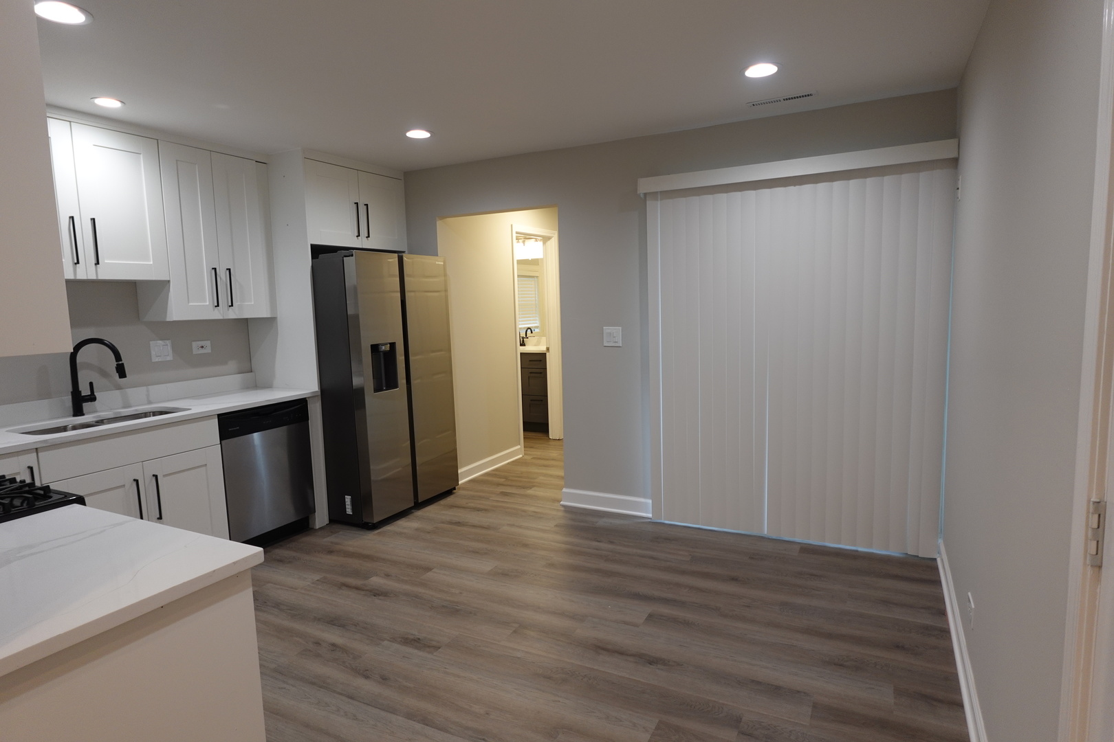 613 South Oltendorf Road Streamwood, IL 60107 - Photo 12 of 37 a kitchen with a refrigerator a sink and cabinets