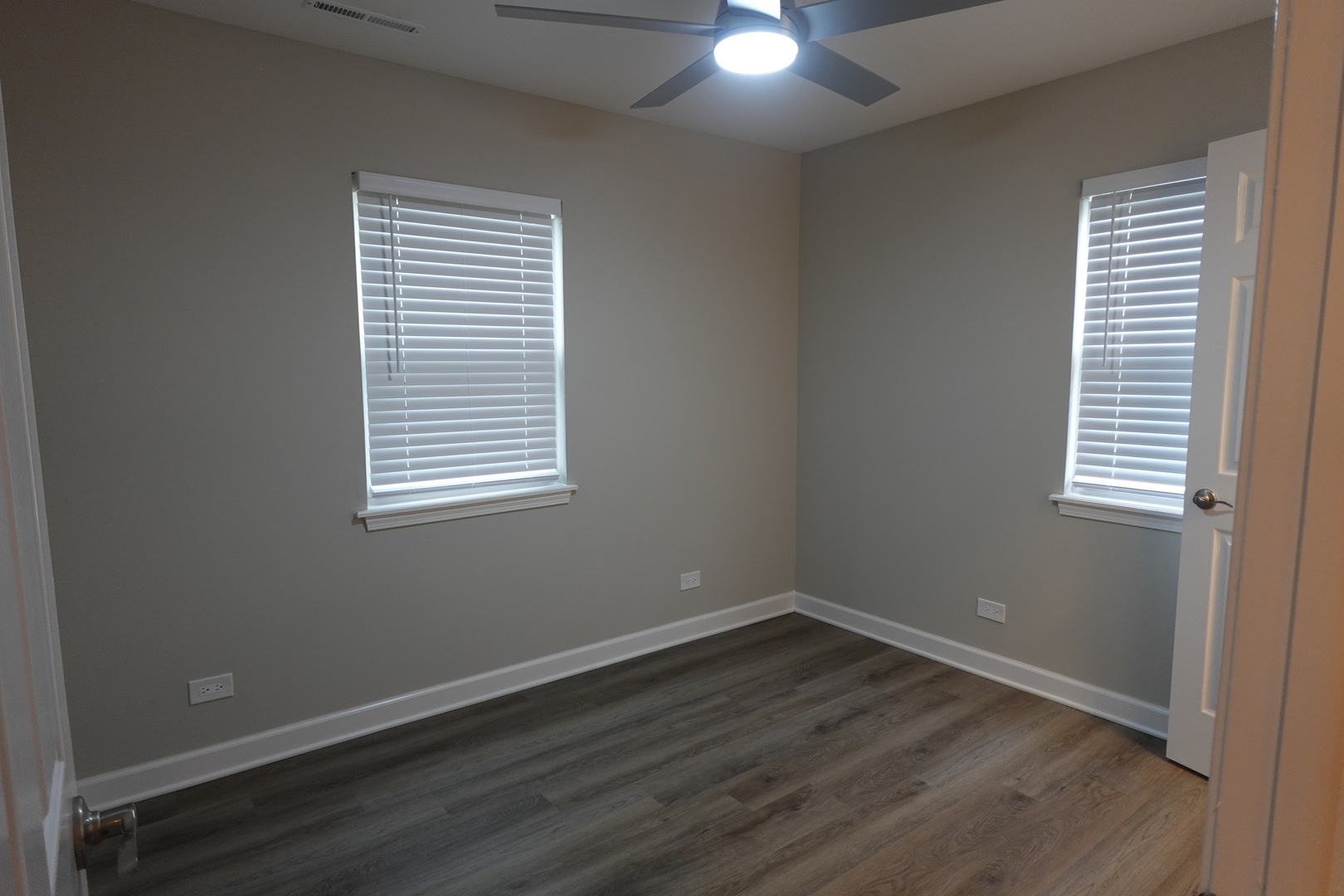 613 South Oltendorf Road Streamwood, IL 60107 - Photo 14 of 37 an empty room with wooden floor and windows