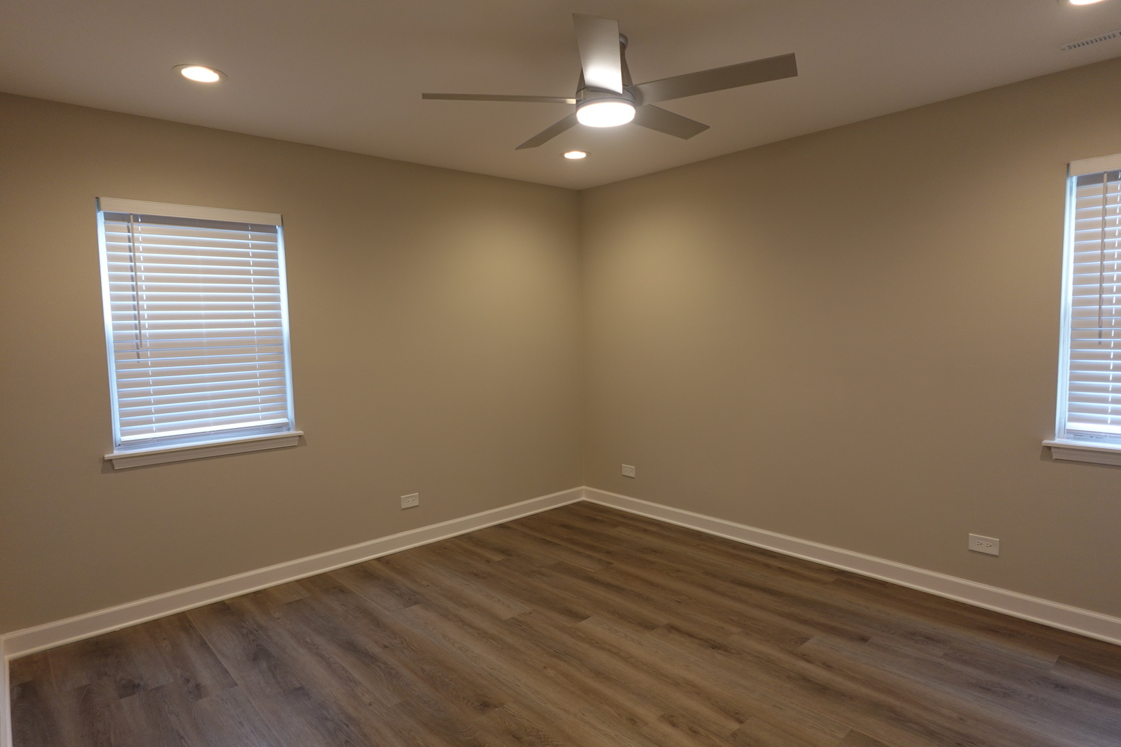 613 South Oltendorf Road Streamwood, IL 60107 - Photo 16 of 37 an empty room with a window and wooden floor