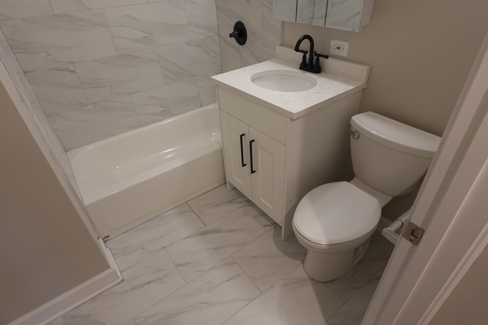 613 South Oltendorf Road Streamwood, IL 60107 - Photo 17 of 37 a white toilet sitting next to a bathroom sink